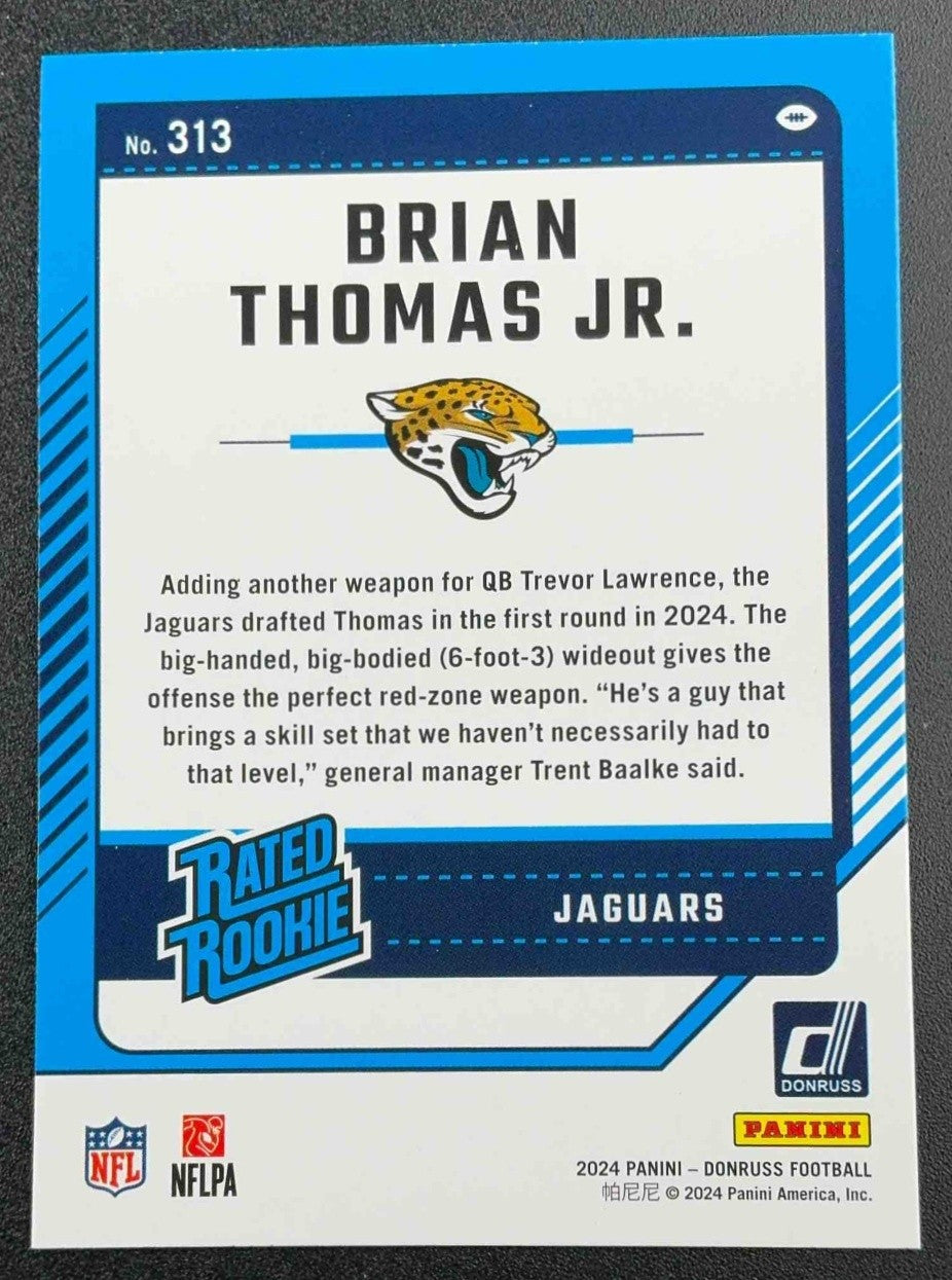 BRIAN THOMAS JR. 2024 PANINI DONRUSS #313 PRESS PROOF BLUE RATED ROOKIE JAGUARS