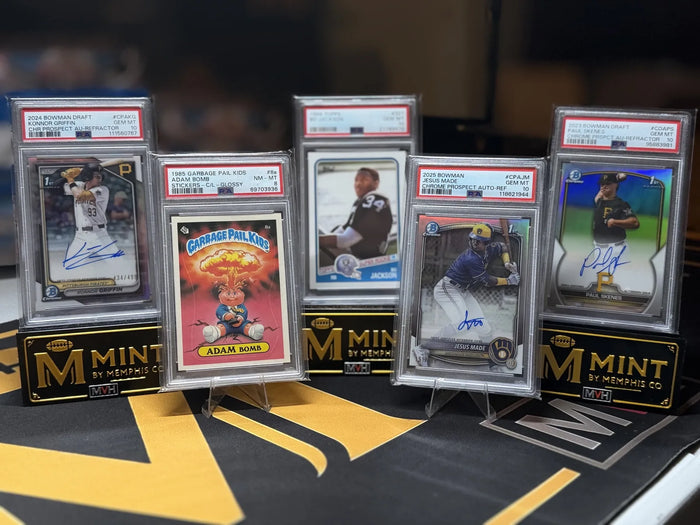 Five PSA graded cards from an inbound collection standing on Mint By Memphis display stands after arrival.