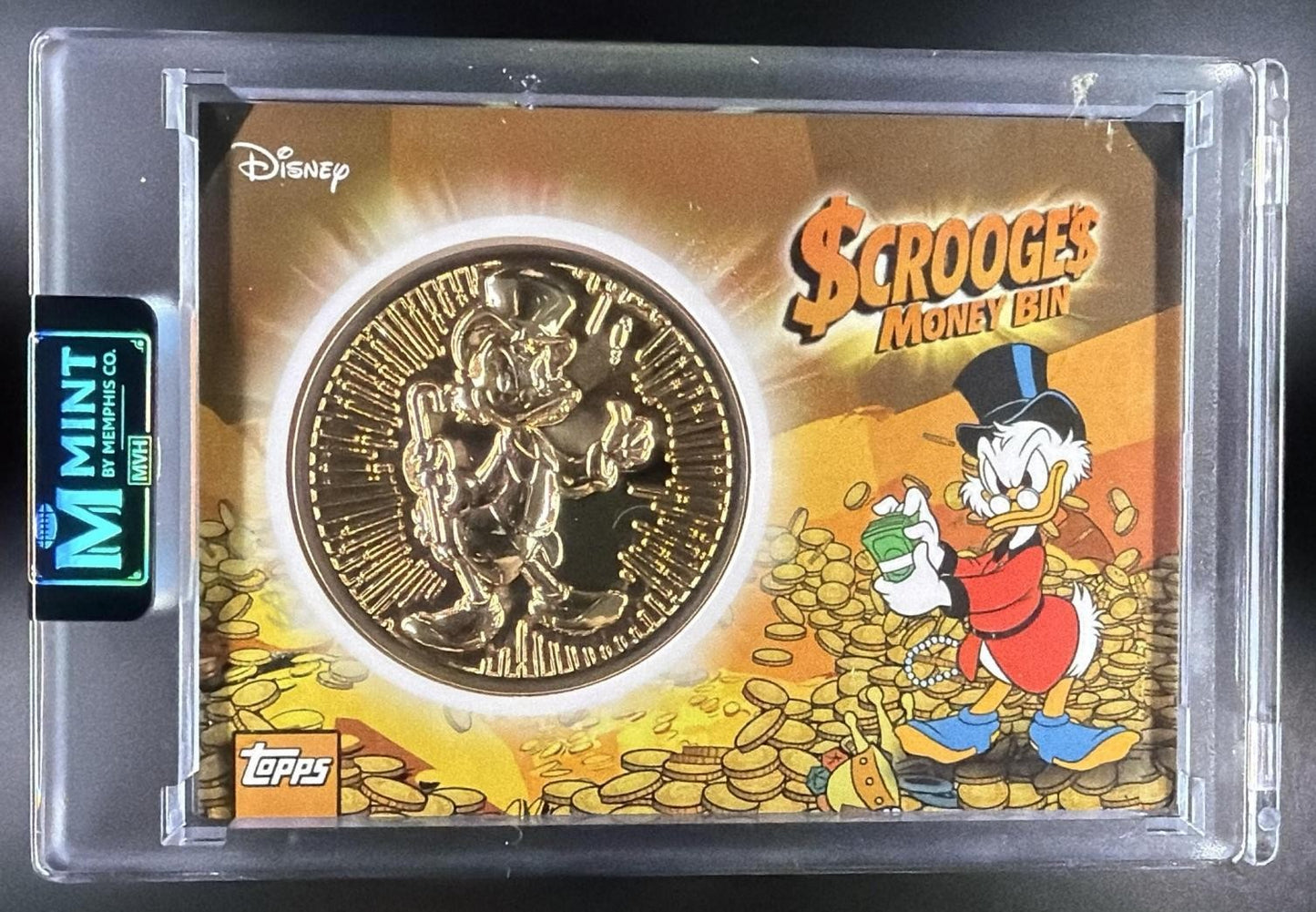 SCROOGE MCDUCK 2026 TOPPS DISNEY NEON #SMB-1 SCROOGE'S MONEY BIN COIN RELIC