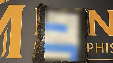 Insured USPS package on the Mint by Memphis mat, shipping label and address redacted for privacy