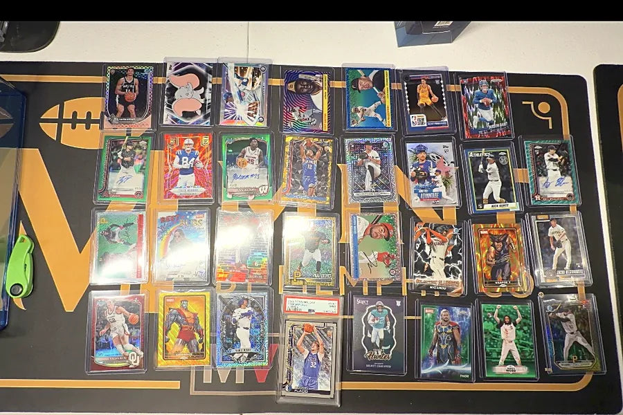 Multi-sport card collection laid out on the Mint by Memphis mat for verification