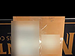 Insured USPS package on the Mint by Memphis mat, shipping label and address redacted for privacy