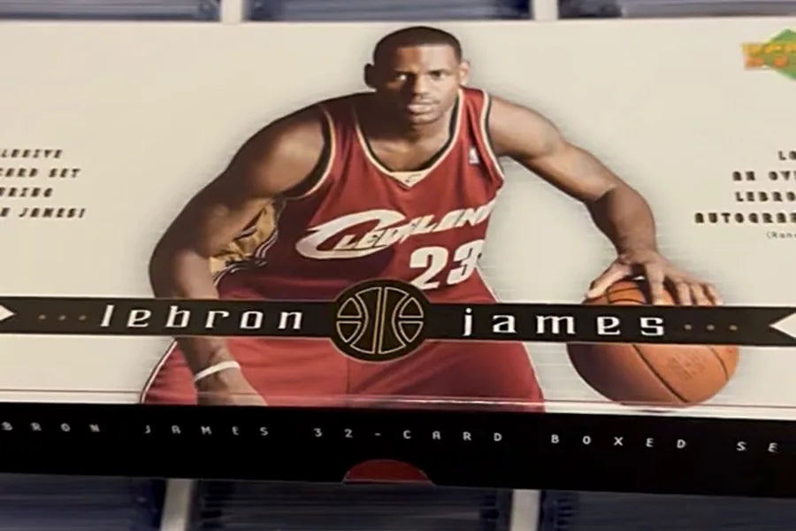 Viktor's collection, a LeBron James boxed set on top of long boxes of thousands of sleeved cards